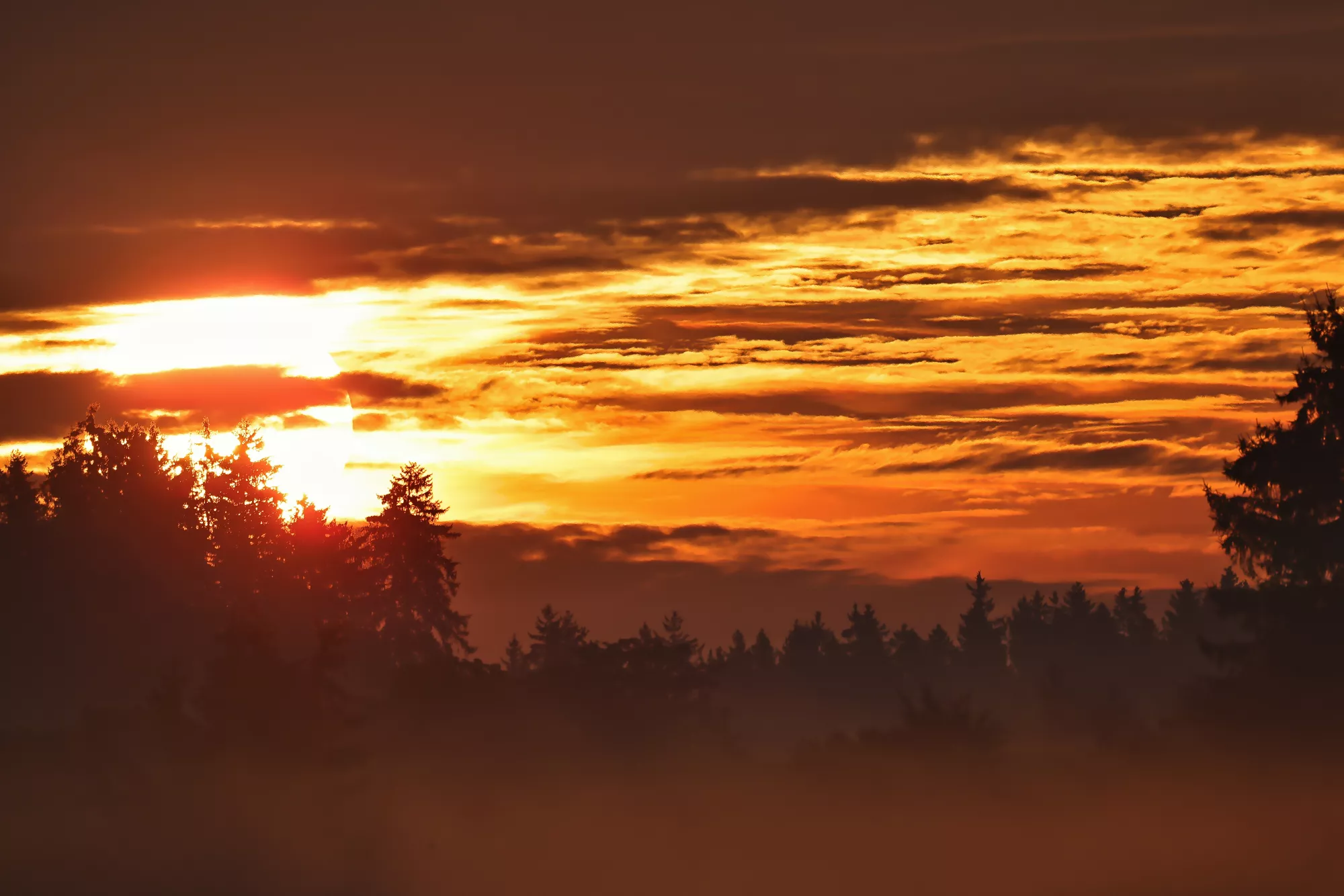 Sonnenuntergang über der Landschaft bei Aitrang